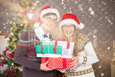 Composite image of portrait of smiling man and woman wearing san