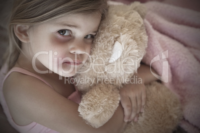 Close-up portrait of a girl with stuffed toy
