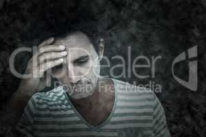 Composite image of upset man with hand on forehead