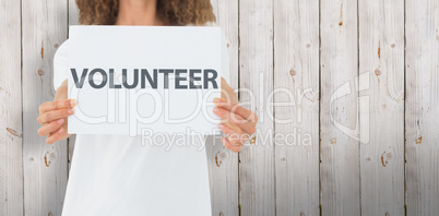 Composite image of volunteer showing a poster