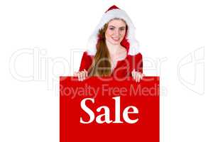 Composite image of pretty girl in santa costume showing card