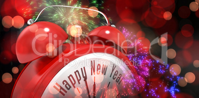 Composite image of happy new year in red alarm clock