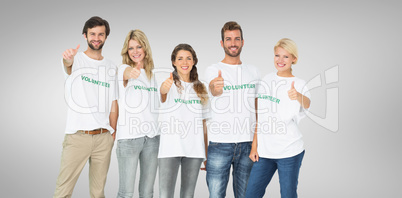 Composite image of group portrait of happy volunteers gesturing