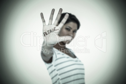 Composite image of serious woman making stop sign over white bac