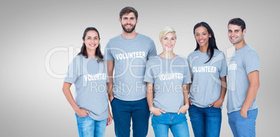 Composite image of volunteers friends smiling at the camera