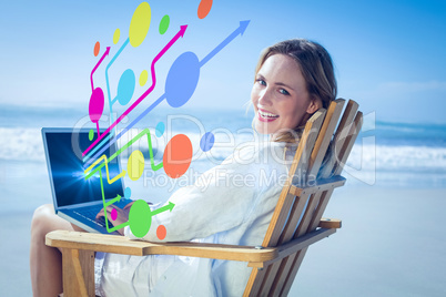 Composite image of gorgeous blonde sitting on deck chair using l