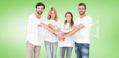 Composite image of group portrait of happy volunteers with hands