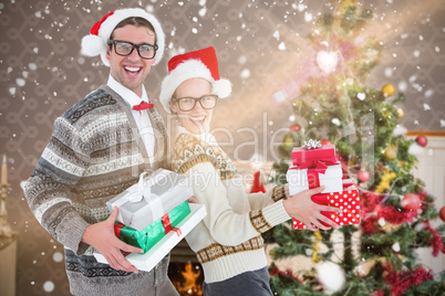 Composite image of portrait of happy man and woman wearing santa