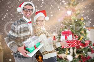 Composite image of portrait of happy man and woman wearing santa