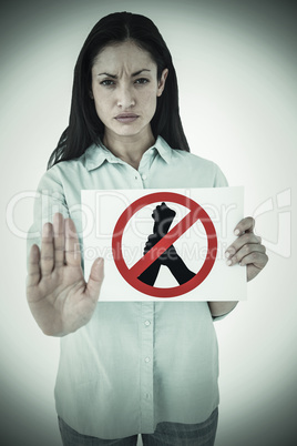 Composite image of woman showing card and saying stop