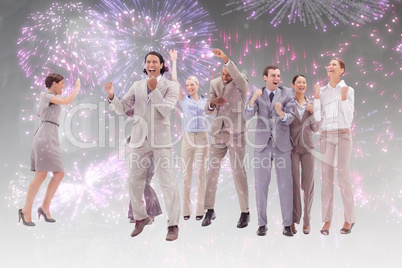 Composite image of very happy business people jumping and clench