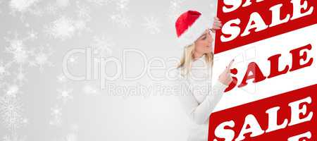Composite image of festive blonde showing poster