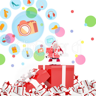 Composite image of santa standing in large gift