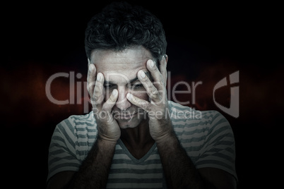 Composite image of upset man with head in hands
