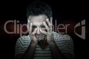 Composite image of upset man with head in hands
