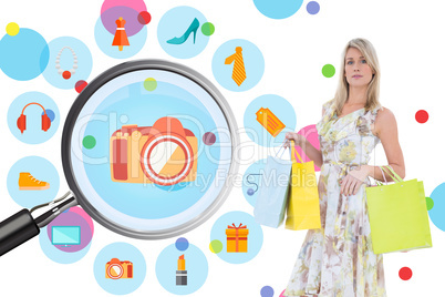 Composite image of elegant blonde with shopping bags