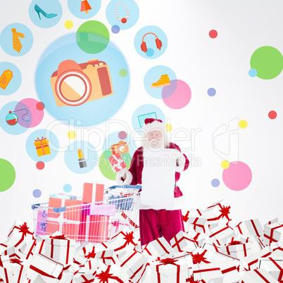 Composite image of santa delivering gifts from cart