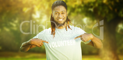 Composite image of happy volunteer in the park