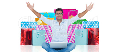 Composite image of successful man with laptop sitting isolated o