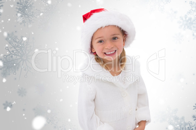 Composite image of cute little girl wearing santa hat