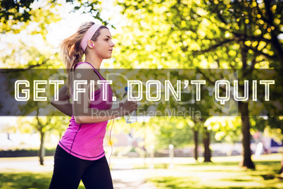 Composite image of fit blonde jogging in the park