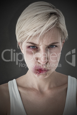 Composite image of angry woman looking at camera