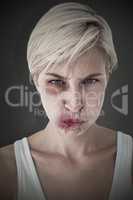 Composite image of angry woman looking at camera