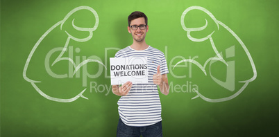 Composite image of man holding a donation welcome note while ges