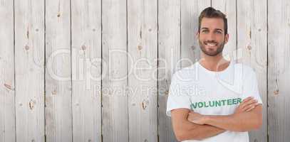 Composite image of portrait of a happy male volunteer with hands