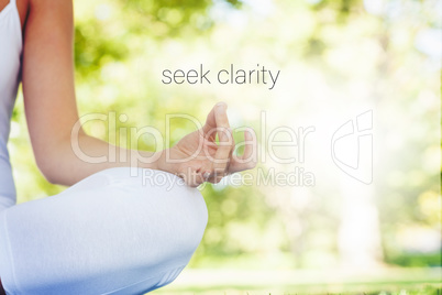 Composite image of mid section of calm young woman meditating