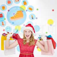 Composite image of excited blonde in santa hat holding shopping
