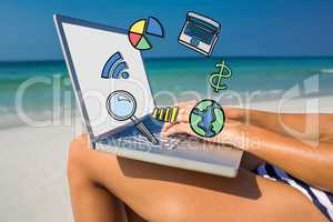 Composite image of woman using laptop on deck chair