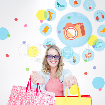 Composite image of woman holding some shopping bags