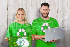 Composite image of portrait of smiling volunteers in recycling s