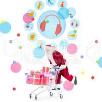 Composite image of santa pushing a shopping cart