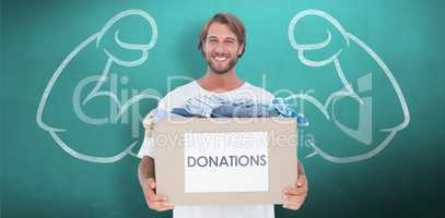Composite image of happy man carrying donation box