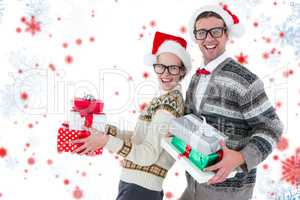 Composite image of portrait of happy man and woman wearing santa