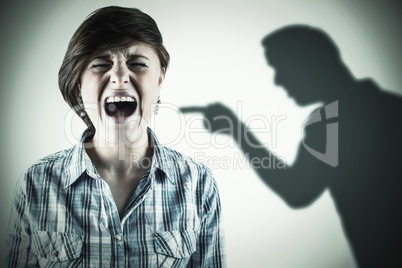 Composite image of pretty brunette shouting