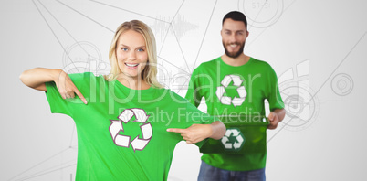 Composite image of portrait of woman pointing towards recycling