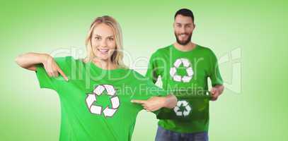 Composite image of portrait of woman pointing towards recycling