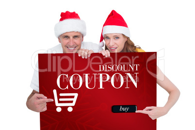 Composite image of festive couple showing a poster