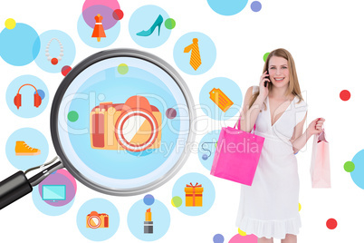 Composite image of happy blonde holding shopping bags and talkin