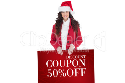 Composite image of cheerful brunette showing white poster