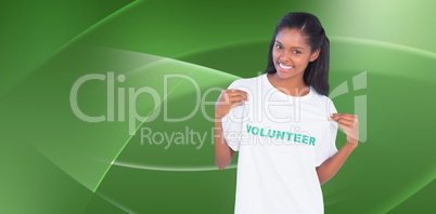Composite image of young woman wearing volunteer tshirt and poin