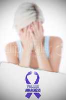 Composite image of sad blonde woman crying with head on hands