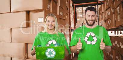 Composite image of portrait of cheerful volunteers in recycling