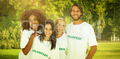 Composite image of smiling group of volunteers