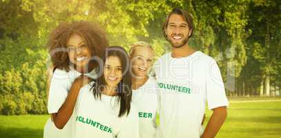 Composite image of smiling group of volunteers