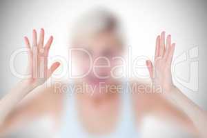 Composite image of angry blonde screaming with hands up