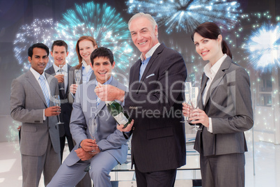 Composite image of businessman opening a bottle of champagne to